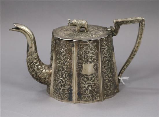 A late 19th/early 20th century Indian white metal teapot, with elephant finial, gross 13.5 oz.